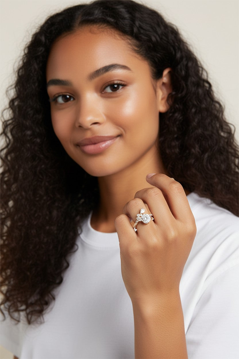 Vikchi Sonaire Rhea Ring: 14K yellow gold ring with 1ct round center diamond, accented by pear, marquise, and round diamonds in a floral cluster setting.