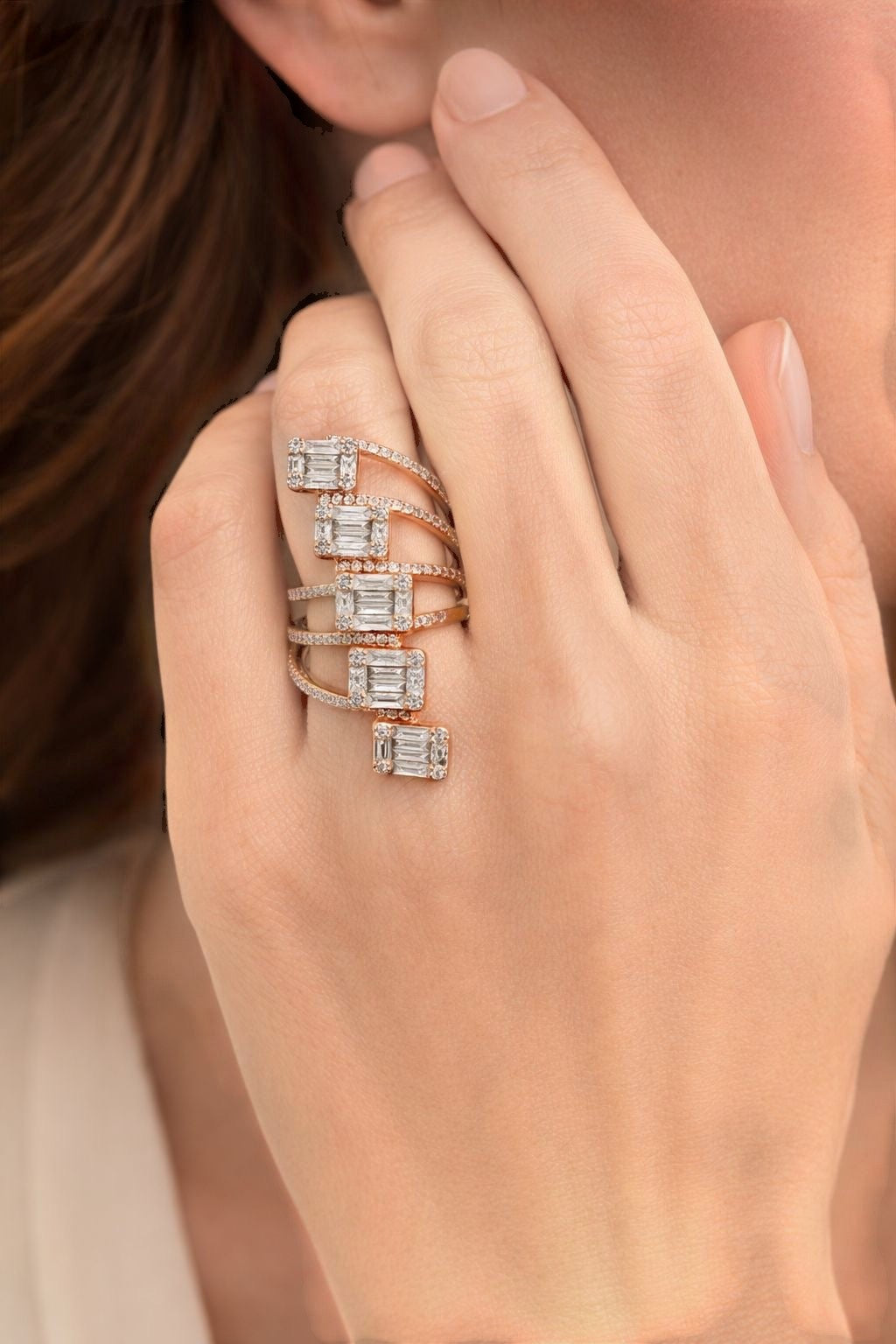 Vikchi Astra Cascade Ring in rose gold with baguette and round diamonds on pavé bands.